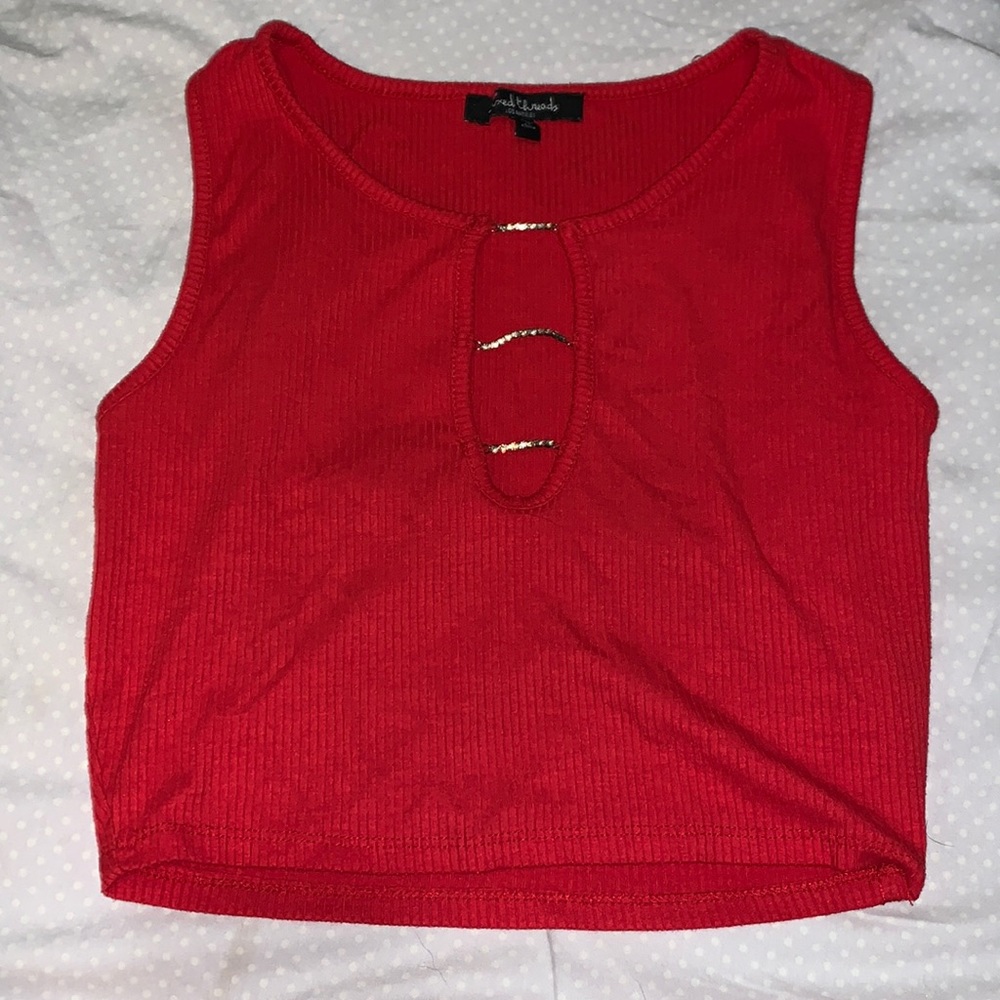 It’s a cropped tangtop that has rhinestones in a row down the middle .